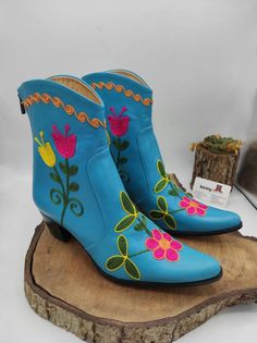 This is handmade embroidered suzani boots. Custom made women boots. Material is genuine leather. Style is cowboy, western boots. Handmade. *(There is heel 2 inches, 5 cm. ( possibile to make higher or shorter ). * Cowboy style pointy toe, ıf you like possibile to make round toe. Every size available. Custom Made. There is colourfull floral pattern on turquoise leather. Waterproof. Made in Turkey. We have door to door express shipping service. If you have any question please contact with. bemyboo Traditional Snip Toe Boots For Spring, Traditional Embroidered Boots For Spring, Handmade Traditional Snip Toe Boots, Handmade Ankle Boots For Festival, Handmade Western Boots, Traditional Boots With Floral Embroidery And Round Toe, Traditional Embroidered Boots For Festival, Traditional Embroidered Festival Boots, Traditional Handmade Closed Toe Boots