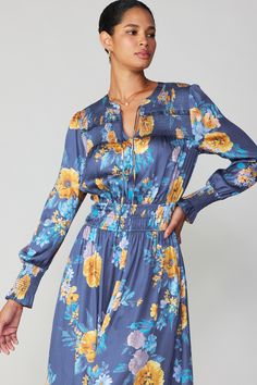 This long-sleeve V-neck midi dress is all kinds of pretty. We're enamored by the details: the tie-up neckline, the smocked yoke, the delicate ruffle trim. Nipped in at the waist, this floral-print number will turn heads wherever you go. •Split neckline with self-tie •Smocked yoke •Ruffle trim •Long sleeves •Elasticized waist •Mid-length hem•Relaxed fit Item number 1990036-1 100% Polyester Long Sleeve Midi Dress With Gathered Waist For Daywear, V-neck Midi Dress With Smocked Cuffs For Brunch, Casual Long-sleeved Midi Dress With Gathered Waist, Casual Long Sleeve Midi Dress With Gathered Waist, Long Sleeve Ruched Maxi Dress For Daywear, Chic Long Sleeve Maxi Dress With Gathered Waist, Long Sleeve Maxi Dress With Smocked Back For Daywear, Long Sleeve Midi Dress With Gathered Waist, Spring Blue Midi Dress With Gathered Waist