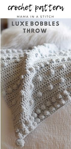 a crochet afghan pattern with text overlay that says,'mama in a stitch luxe bobbles throw '