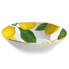 a bowl with lemons and leaves painted on the side, in yellow and white