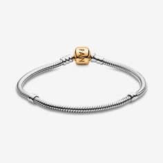 One of our signature styles, used by women around the world as a base for unique combinations of meaningful charms, this two-tone snake chain charm bracelet is made from sterling silver and solid 14k gold. Detailed with threads and fitted with a logo barrel clasp, it's a classic carrier for meaningful adornments. - Pandora FINAL SALE - Pandora Moments Snake Chain Bracelet - Sterling silver and 14k Gold - Sz. 9.1 in Chain Charm Bracelet, Signature Styles, Snake Chain Bracelets, Pandora Style, Mesh Bracelet, Charm Bangle, Sterling Silver Charm, Snake Chain, Bracelet Sizes