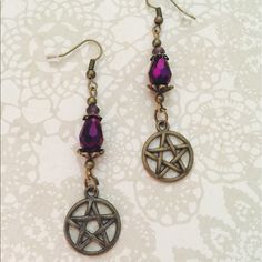 Gorgeous Earrings With A Fire Polished Crystal Drop Topped With Brass Ornate Bead Caps. Small Deep Purple Czech Crystal And Brass Pentagram Charms. Finished With Fish Hooks. Approximately 2.5 Inches Top Of Hook To Bottom Of Charm. Purple Metal Crystal Earrings As Gift, Purple Crystal Metal Earrings For Gifts, Purple Metal Crystal Earrings For Gift, Nickel-free Purple Jewelry For Festivals, Nickel-free Purple Earrings For Festival, Nickel Free Purple Earrings For Festival, Purple Metal Earrings, Adjustable Purple Metal Earrings, Purple Bohemian Crystal Earrings