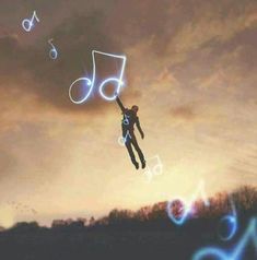 a man flying through the air while holding onto a string with musical notes coming out of it