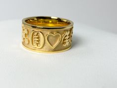 On display is an adinkra wedding band, 8mm width, heavy gold wedding band available in 14k, 18k. What is Adinkra? Adinkra symbols are visual representations of concepts, proverbs, and aphorisms. They originated from the Gyaman people of Ghana and Côte d'Ivoire. At their genesis the symbols were featured as prints on cloth which royals wore to important ceremonies. Over time the symbols have been adopted and used for various purposes. The symbols now grace logos, clothing, furniture, architecture Adinkra Symbols, Visual Representation, Gold Wedding Band, Ghana, Wedding Engagement, Wedding Rings Engagement, Wedding Bands, Jewelry Rings, Wedding Rings