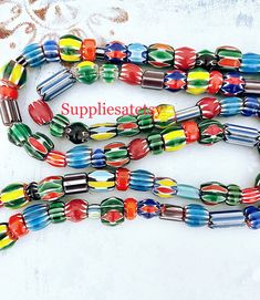 "You will receive: Artisan handcrafted assortment Ethnic African & Nepalese rare Glass beads. Mix Shapes, sizes & colors glass chevron beads. Very Unique, you'll love them! Sold by strand 16\" Approx 40+ beads by strand Random Size from : 8-15mm Approx hole from: 1-3mm Please select qty at drop box Contact me if you need larger quantity. *Please note these are hanmade beads, not close to perfect, they are unique and rare some are raw cut and unpolished*" Eclectic Multicolor Beaded Bracelets With Wooden Beads, Eclectic Multicolor Wooden Beaded Bracelets, Multicolor Large Beads For Crafting, Large Multicolor Beads For Crafting, Bohemian Czech Glass Oval Beads, Bohemian Oval Czech Glass Beads, Multicolor Traditional Beads For Jewelry Making, Traditional Multicolor Beads For Jewelry Making, Eclectic Multicolor Beads For Festival