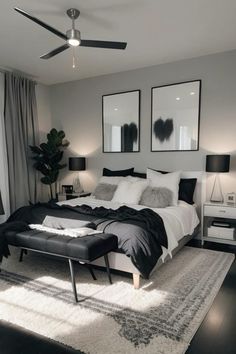 a bedroom with black and white decor in it