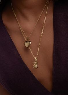 A bold show of love—hold this modern heirloom close to your heart.Luxuriously weighted and fits on any chain.Layer with a link chain for texture. Features a Petite Rope Chain.Our puffed heart pendant is solid, not hollow, and has significant weight to it. 14k solid gold—always Silver pendant weight: Approx 4.4g Gold pendant weight: Approx 5.5g Measurements: 14.5mm x 14.5mm 14k Gold Heart Chain Necklace, Gold Plated Heart Pendant Chain Necklace, Gold-tone Heart Necklace With Gold Chain, Gold-tone Heart Chain Necklace, Gold-tone Heart Necklace With Adjustable Chain, Rib Ring, Teddy Bear Pendant, Diamond Huggie Earrings, Fall Rings