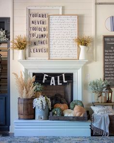 a living room filled with lots of furniture and fall decorations on top of a mantel