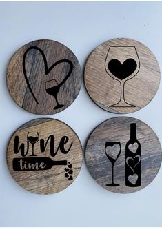 four coasters with wine related designs on the front and back, one has a glass in it