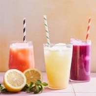 three different types of drinks on a table