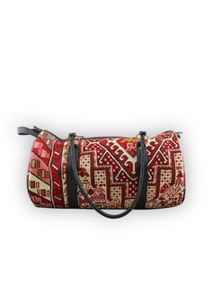 kilim-travel-duffle-end Vintage Weekender Bag For Travel, Vintage Duffle Bag With Leather Handles For Overnight Trips, Vintage Weekender Bag With Luggage Sleeve For Travel, Vintage Rectangular Duffle Bag For Travel, Vintage Travel Bag With Leather Handles For Weekend Trips, Vintage Weekender Bag With Luggage Sleeve For Overnight Trips, Vintage Travel Bag With Luggage Sleeve For Weekend Trips, Traditional Rectangular Duffle Bag For Travel, Vintage Satchel Travel Bag For Weekend Trips