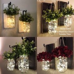 three mason jars with flowers in them hanging from the wall, one is filled with lights