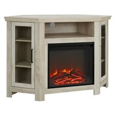 an entertainment center with a fireplace and shelves