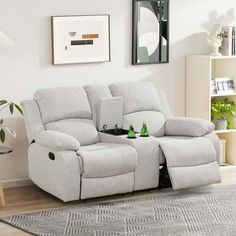 the reclining loveseat has two bottles on it