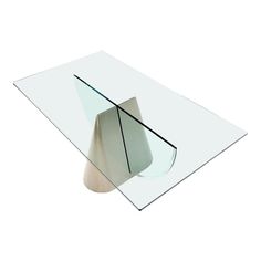 a glass table with a white base and curved edges on the top, in front of a white background