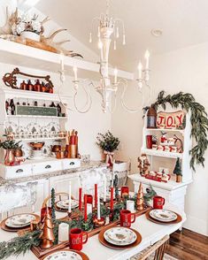 a dining room table set for christmas dinner