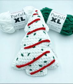 crochet christmas tree ornament with red, white and green yarns