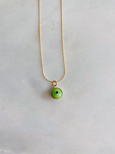 "It's all in the lil details💚 Gorgeous vibrant green evil eye on our gold plated gold snake chain. Such a fun piece to layer with⚡️ Length: 14-17\" adjustable" Green Charm Necklace With Adjustable Round Pendant, Green Charm Necklace With Round Pendant And Adjustable Chain, Everyday Green Round Pendant Charm Necklaces, Everyday Green Round Pendant Charm Necklace, Green Gold Plated Necklace With Adjustable Chain, Green Charm Necklace With Adjustable Chain, Adjustable Green Charm Necklace, Green Adjustable Chain Charm Necklace For Everyday, Trendy Green Charm Necklace For Gift