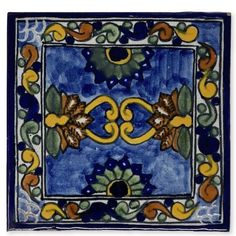 a blue and yellow tile with flowers on it