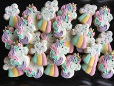 decorated cookies with unicorns and stars on them