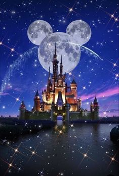 the castle is lit up at night with stars in the sky and moon behind it