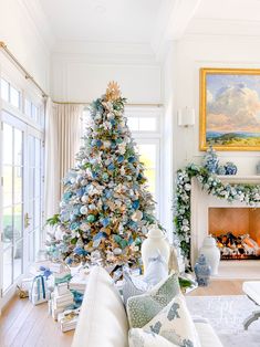 a living room with a christmas tree in the corner