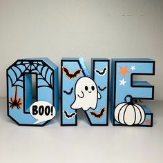 the word boo spelled out with halloween decorations