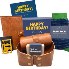 an assortment of birthday gifts including socks, wallets and cards