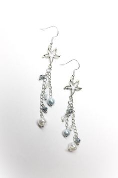 Dangle earrings with double silver chain, starfish-shaped pendants and luminous light blue and transparent beads. Wear them for your summer evenings, with a nice dress and your hair tied up you will make a great impression! ✨️ The nubs are made of steel, but are also available in plastic for allergic people (contact us privately). Measurements/sizes: earring length (including lever): 9 cm starfish width: 1.5 cm THE EARRINGS ARRIVE FROM ITALY AND ARE SHIPPED WITH POSTAL STAMP 📬 SO THEY CAN EVEN ARRIVE AFTER 3 MONTHS. For fast shipping via courier🚛 contact us privately BEFORE PURCHASING. Light Blue Earrings, Stella Marina, Starfish Earrings, Silver Lights, Postal Stamps, Summer Evening, Blue Earrings, Starfish, Hair Ties