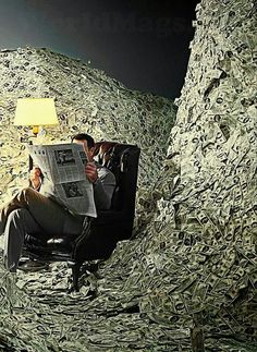 a man is sitting in a chair covered with money and reading the paper while looking at his cell phone