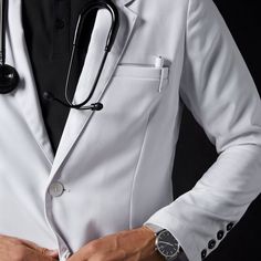 a male doctor in a white suit with a stethoscope on his chest