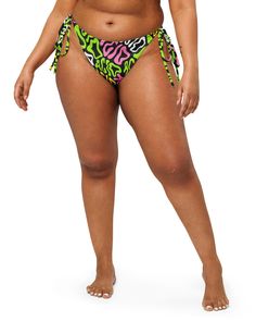 Elevate your rave style with One Stop Rave's exclusive Candy Acid Recycled String Bottoms! These mesmerizing bottoms boast a trippy print featuring the word "acid" melting in pink, green, white, and yellow hues against a bold black background. Made from soft recycled polyester with double-layering and UPF 50+ protection, these bottoms ensure both comfort and style all summer long. Join the sustainable fashion movement with these made-to-order string bottoms, reducing overproduction and making th Multicolor Tie-side Bottoms For Festival, Fitted Green Bottoms For Rave, Playful Graphic Print Beach Bottoms, Trendy Green Bottoms For Beach Season, Beach Bottoms With Multicolor Graphic Print, Summer Festival Bottoms With Graphic Print, Multicolor Graphic Print Beach Bottoms, Green Rave Swimwear, Green Tie-side Bottoms For Beach Season