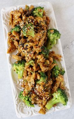 broccoli and noodles on a plate with sesame seeds