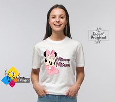 a woman wearing a minnie mouse t - shirt