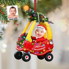 a christmas ornament with a baby's photo hanging from the top of it