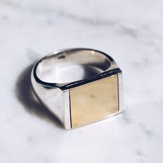 925 Sterling Silver and glossy Brass Mixed Metal Ring in sizes for both men and women. This minimalist ring has a simplistic brass square flat top but lot's of style and flat top rings are definitely in right now!  Available in Gold Brass https://etsy.me/2w23uLW Ring Size  Available in all sizes. Please be sure to find your exact ring size for the finger you want before ordering. See image chart above or you can use the chart on my website as a guide - https://jewelrylab.co/pages/ring-sizing-tips Every piece is handcrafted in Bali and made with Intention, Love, and Soul so that it can be felt by it's wearer and ultimately change our energy and lives in a positive way. Each with it's own story of insight and love, our pieces, like humans, are organic and asymmetrical in form. Free worldwide Flat Top Ring, Mens Pinky Ring, Gold Pinky Ring, Unique Mens Rings, Mens Band Rings, Mixed Metal Rings, Chic Flats, Rings Unique, Detailed Jewelry