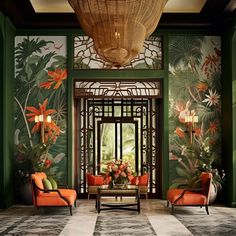 the lobby is decorated with tropical wallpaper and orange chairs, which are accented by chandeliers