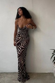 This bold maxi dress features an eye-catching combination of leopard and zebra prints, creating a striking pattern that's sure to turn heads. With its comfortable straps and flowing silhouette, it's perfect for outings or exotic vacations. Details: Elasticity: Slight Stretch Fabric Type: POLYESTER Silhouette: STRAIGHT Neckline: V-Neck Material: POLYESTER Size (IN) Bust Size Skirt Length Waist Size Hip Size S 26.77-37.01 44.49 25.20-29.13 31.50-37.01 M 28.35-38.58 45.28 26.77-30.71 33.07-38.58 L Trendy Zebra Print Spring Dresses, Summer Black Zebra Print Maxi Dress, Summer Black Maxi Dress With Zebra Print, Black Zebra Print Maxi Dress, Trendy Zebra Print Dresses, Exotic Vacations, Strap Maxi Dress, Zebra Dress, Zebra Stripes