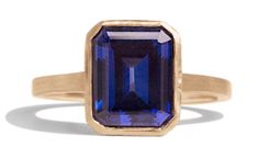 an image of a ring with a blue stone