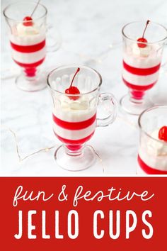 jello cups with cherries and whipped cream in them on a white tablecloth