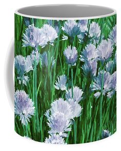 a painting of purple and white flowers in the grass coffee mug featuring an image of blue and white flowers