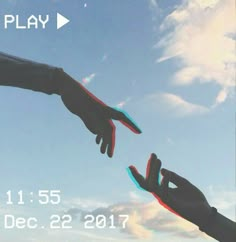 two hands reaching out towards each other in front of a blue sky with white clouds