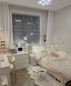 a bedroom with a bed, desk and window