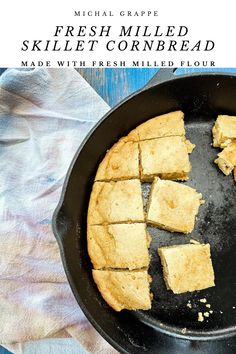 fresh baked skillet cornbread in a cast iron skillet on a blue wooden table