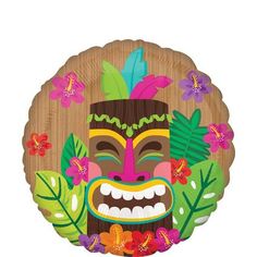 a wooden plate with a tiki mask on it's face and flowers around it