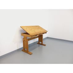 a small wooden table sitting on top of a floor