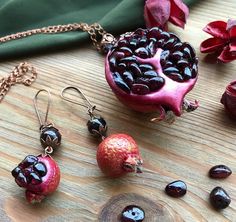 "Garnet Pomegranate pendant & earrings Botanical Fruit jewelry Garnet Luxury Feminine jewelry set Elegant Royal Red pendant Mother Wife gift Original pomegranate jewelry set of juice pendant and earrings. Inside pomegranate - natural garnet gemstones. all beads - garnet. Skin - polymer clay. Earrings is different.. one - full small fruit, second - open. This pendant looks very naturally.. like a real bright and juice pomegranate. I think this luxury jewelry can be the perfect gift for mother Spiritual Gemstone Jewelry Sets For Gifts, Handmade Jewelry For Celebration And Gift Season, Valentine's Day Gift Necklaces With Matching Earrings, Unique Necklace With Matching Earrings For Gift, Garnet Jewelry For Valentine's Day Gift, Red Pendant Jewelry Sets For Gifts, Valentine's Day Garnet Jewelry Gift, Traditional Garnet Jewelry Gift, Traditional Garnet Jewelry For Gifts