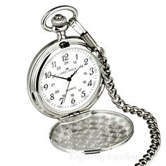 A silver pocket watch makes a perfect elegant gift for so many occasions. Comes with free engraving of any message of your choice.- Elegant white dial.- Mirror finish silver case.- Inside the front opening is a nice frosted pattern.- Comes with a 12' chain.- Watch case diameter is 45mm.- Complete with a black pouch and spare battery.Ideal as a wedding gift, for your best man, ushers, groomsmen, father of the bride/groom, etc.Would you like to engrave this item? Please see the engraving informati Groomsmen Pocket Watch, Watch Locket, Father Of The Groom, Personalized Engraved Gifts, Silver Pocket Watch, Personalized Watches, Pocket Watch Chain, Desenho Tattoo, Bespoke Gifts