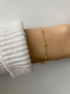 This beautiful little bracelets is perfect for a minimalist look! It is available in both gold and rose gold-filled. D E T A I L S  *18k Gold filled/Rose gold filled satellite chain - 1.6mm curb with 2.7mm ball  *Gold fill is a wonderful alternative to real gold and unlike gold plating does not rub off.  *Hall marked gold filled spring ring clasp closure. S I Z I N G *  H E L P Choose the length from the drop down menu. Use the length guide as a reference. If unsure about the size you need  choose the EXTENDER option . C A R E * T I P This is a dainty bracelet so please treat it with care. To maintain it in great condition avoid contact with water, perfume and harsh chemicals.  Also remove when exercising, sleeping and doing housework in case it snags. P A C K A G I N G All our products ar Minimalist Satellite Chain Bracelet As Gift, Minimalist Satellite Chain Bracelet Gift, Dainty Satellite Chain Bracelet For Everyday, Dainty Rose Gold Chain Bracelet With Delicate Chain, Dainty Rose Gold 14k Gold-filled Chain Bracelet, Delicate Rose Gold Satellite Chain Bracelet, Delicate Gold Bracelet With Satellite Chain, Dainty Rose Gold Bracelets With Satellite Chain, Dainty Rose Gold Bracelet With Satellite Chain