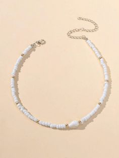 White Beaded Choker Necklace White beads with Gold accents Choker. Small conch shell finishes the look. Very Pretty! Measures 14* with 3" extension Simple Beaded Necklace, Beaded Chocker, Simple Beaded Necklaces, Pretty Jewelry Necklaces, Handmade Beaded Necklaces, Pretty Jewelry, Necklace White, Conch Shell, Beaded Choker Necklace